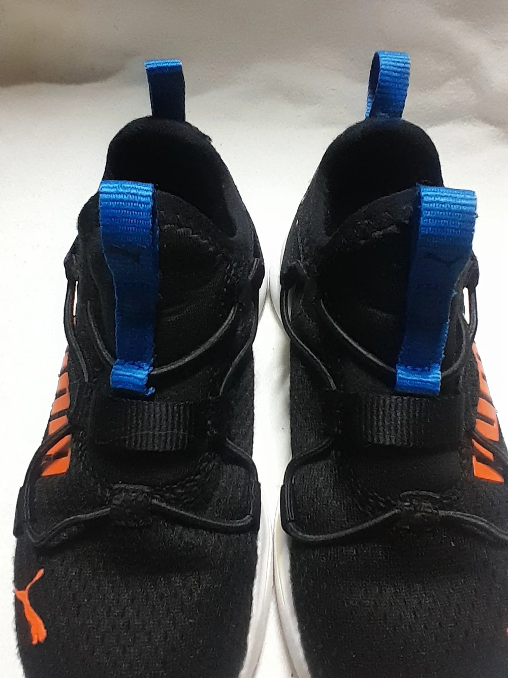 Puma Kids Black Sneakers with Orange Logo and Blue Accents